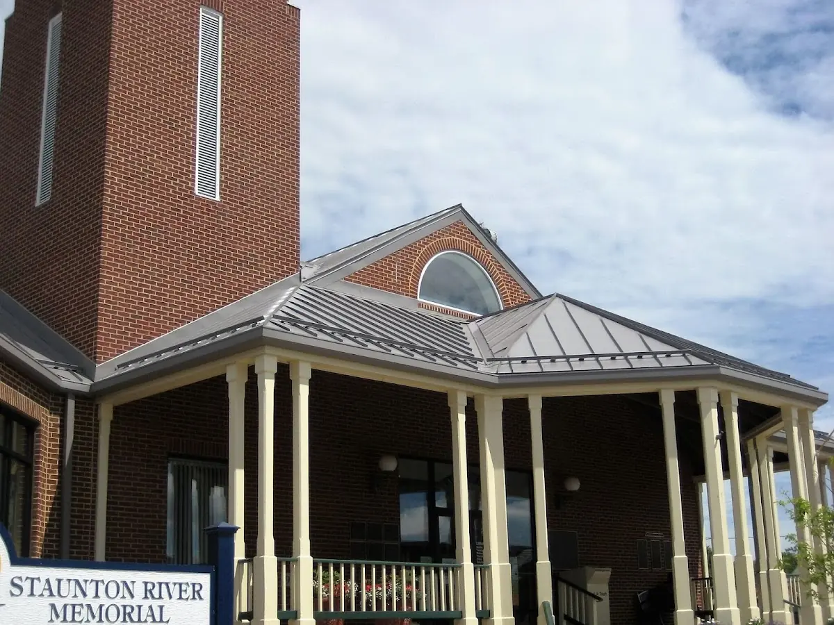 Skilled roofing craftsmen working on a residential roof in Gloucester City